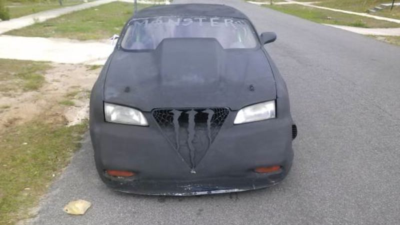 Illustration for article titled This 'Custom' Mazda 626 Is Proof That Energy Drinks Are Bad For You
